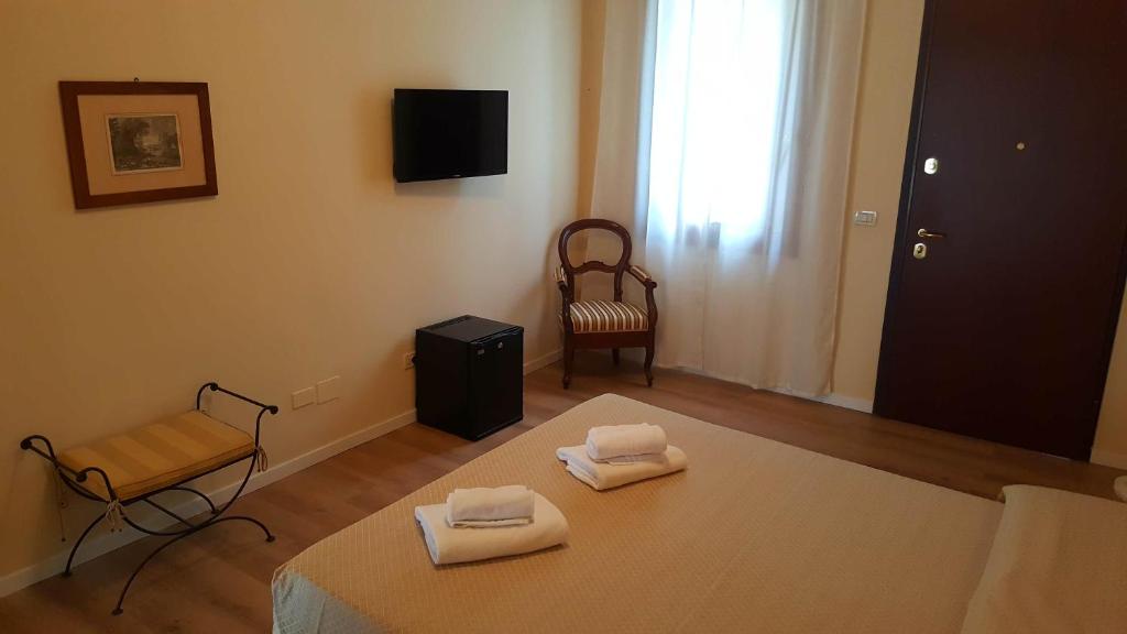 Postel nebo postele na pokoji v ubytování B&B Villa Fiorini