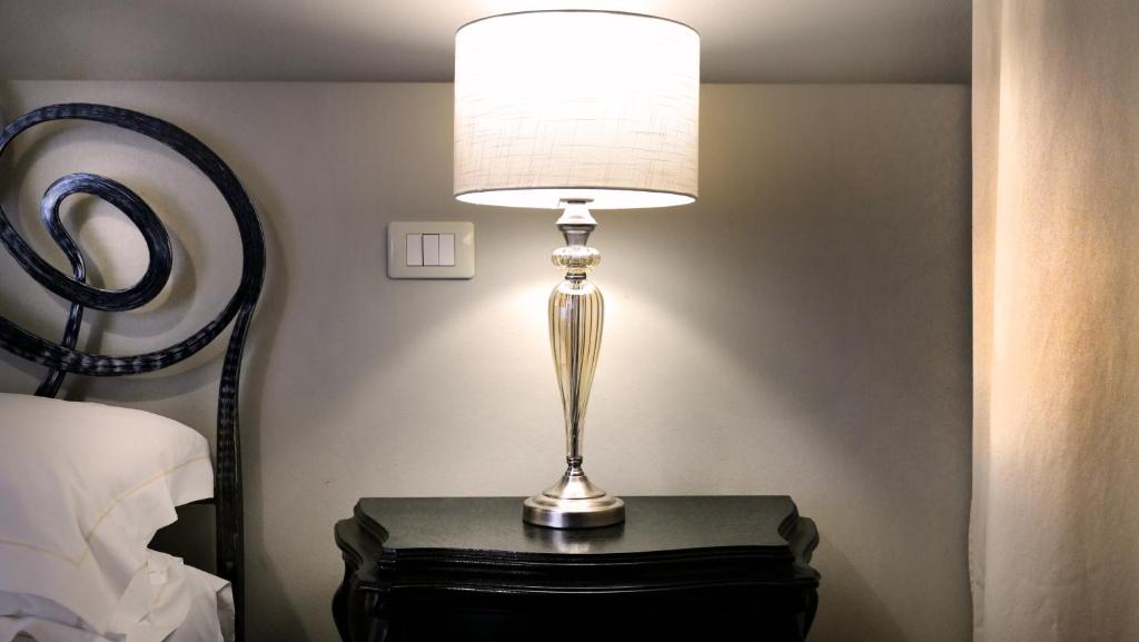Postel nebo postele na pokoji v ubytování La Corte Dei Sogni B&B
