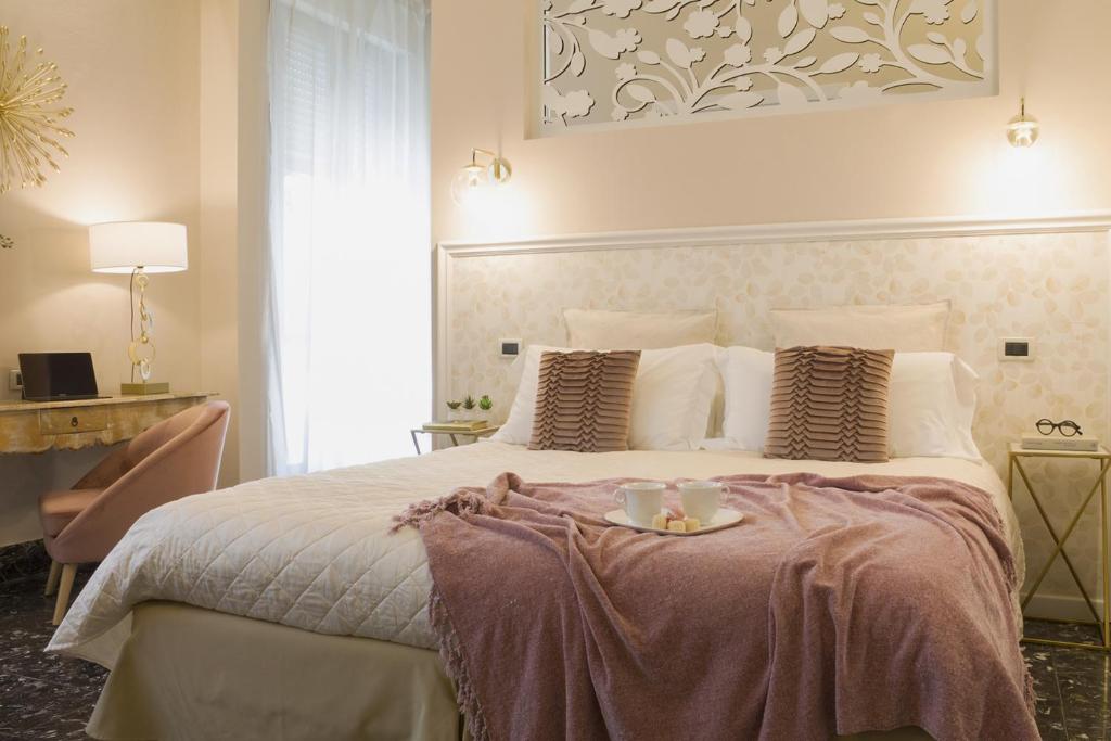Posteľ alebo postele v izbe v ubytovaní Accanto Al Centro B&B