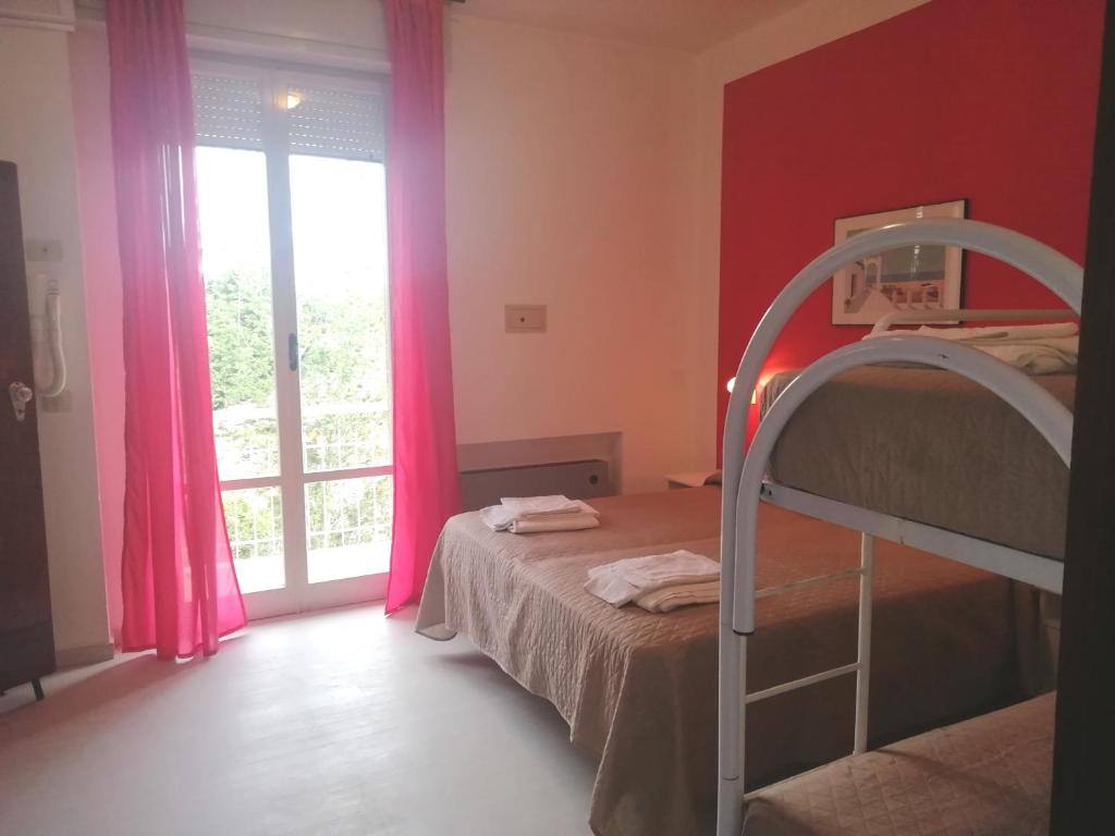 Postel nebo postele na pokoji v ubytování Hotel Rita