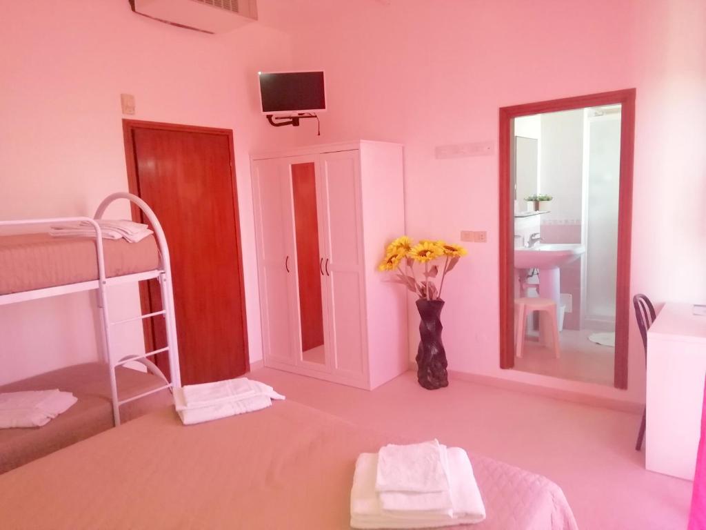 Postel nebo postele na pokoji v ubytování Hotel Rita