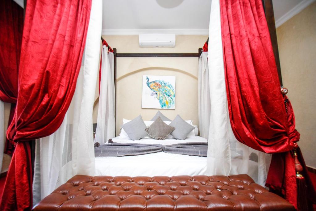 Postel nebo postele na pokoji v ubytování Kasbah Ait Oumghar