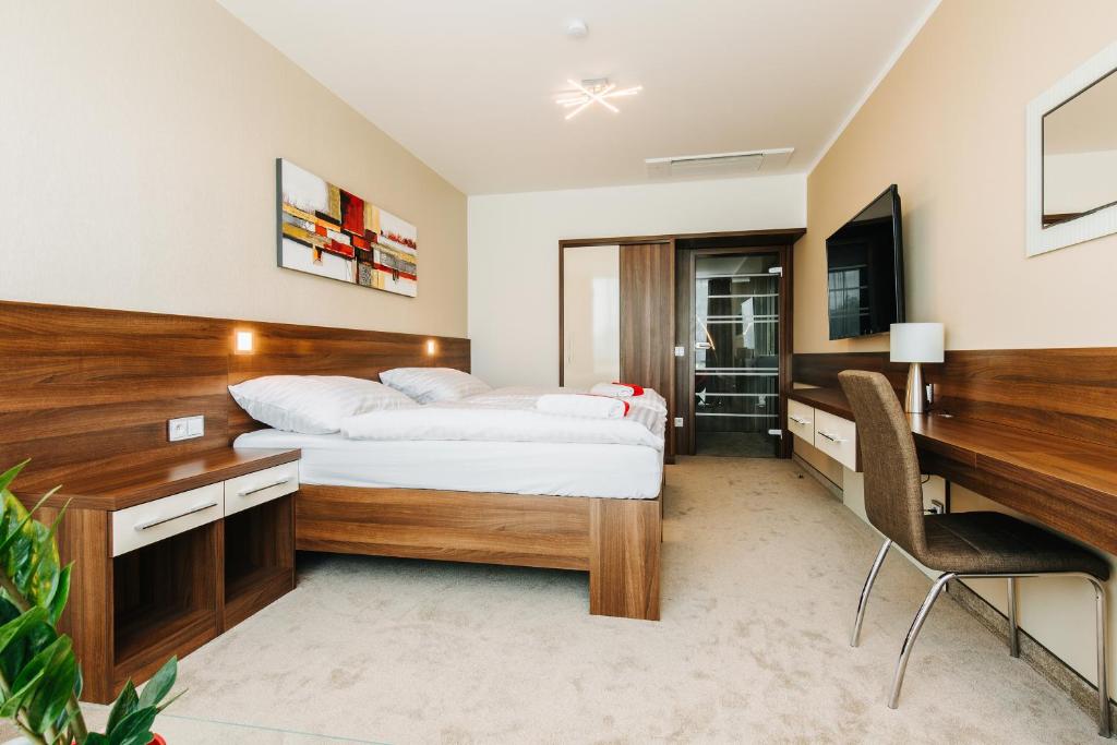 Łóżko lub łóżka w pokoju w obiekcie Pierre Hotel