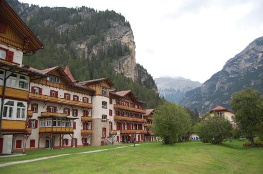 a group of buildings in front of a mountain at VILLAGGIO TURISTICO PLONER in Dobbiaco
