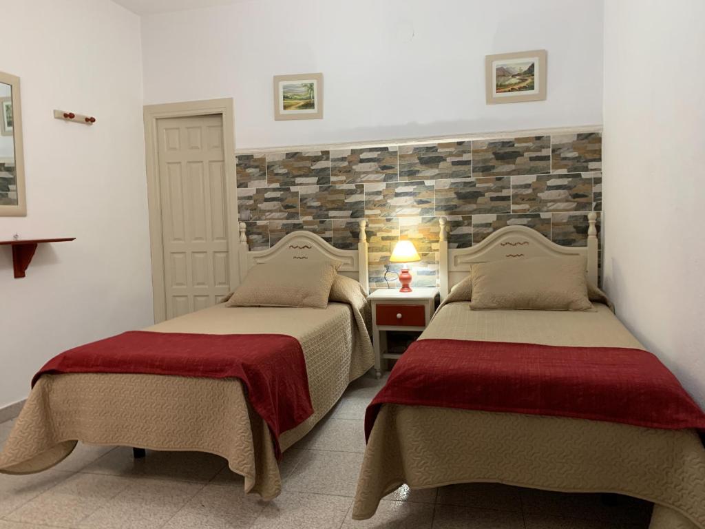 Postel nebo postele na pokoji v ubytování Hostal Atalaya en Capileira CB