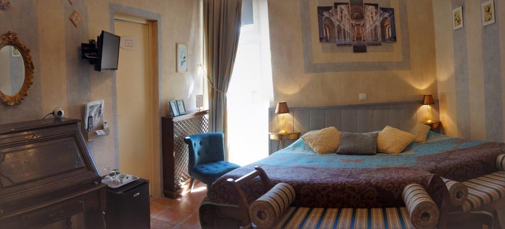 Postel nebo postele na pokoji v ubytování Le Manoir du Raveyron
