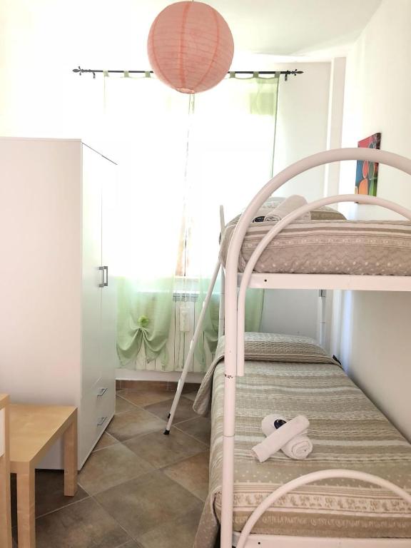 Łóżko lub łóżka w pokoju w obiekcie Miluna B&B