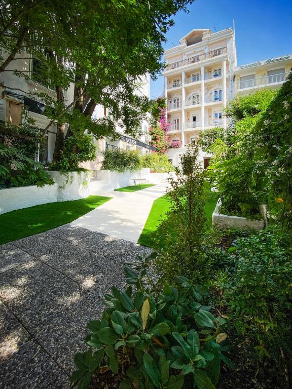 a walkway in front of a building at Hotel Molière in Cannes