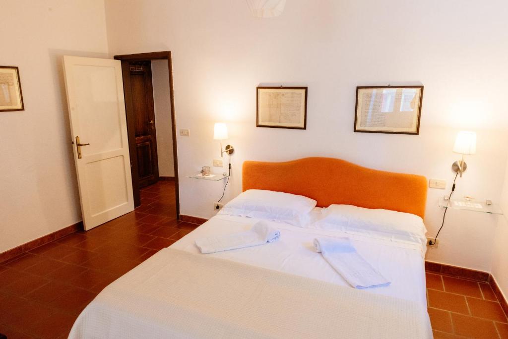 Postel nebo postele na pokoji v ubytování B&B Borgo di Oliveto - Appartamenti con Cucina