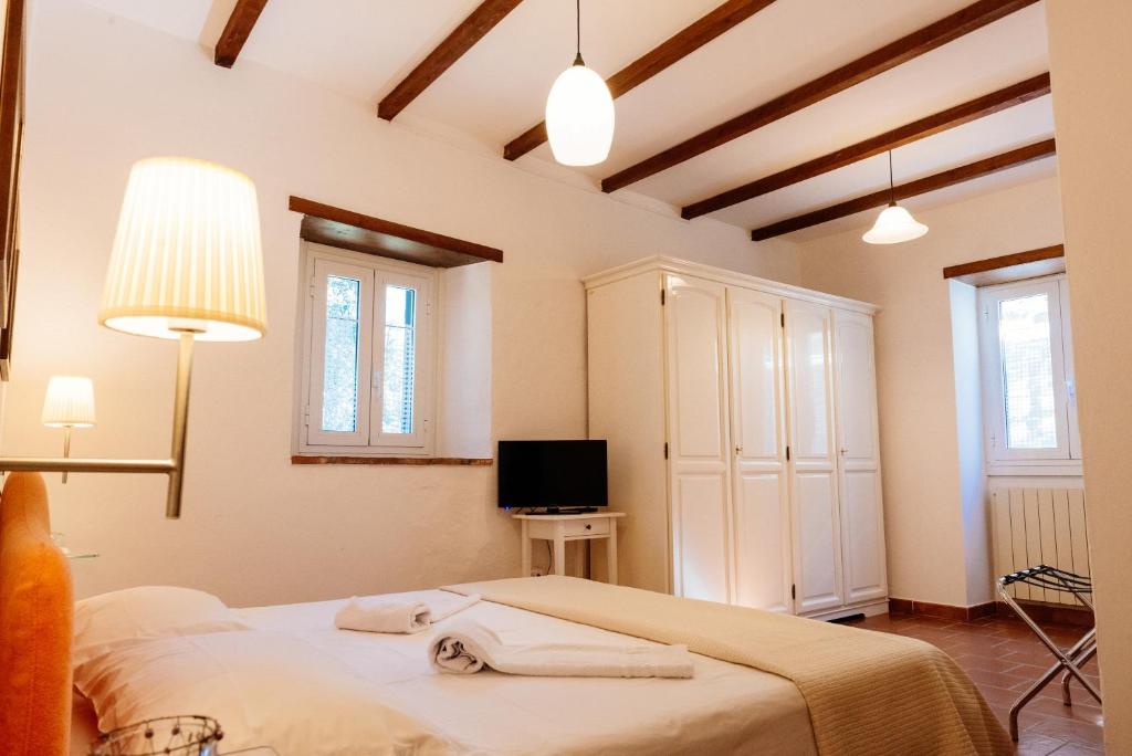 Postel nebo postele na pokoji v ubytování B&B Borgo di Oliveto - Appartamenti con Cucina