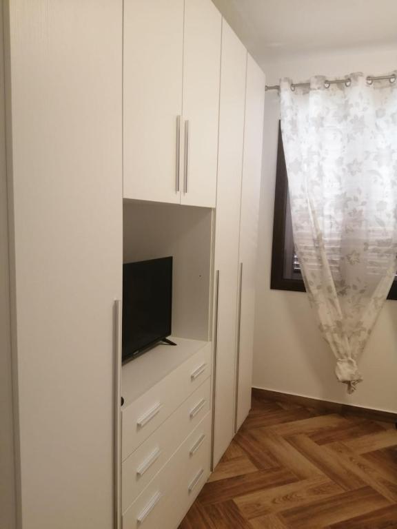 Televízia a/alebo spoločenská miestnosť v ubytovaní Villa Giorgia 2020