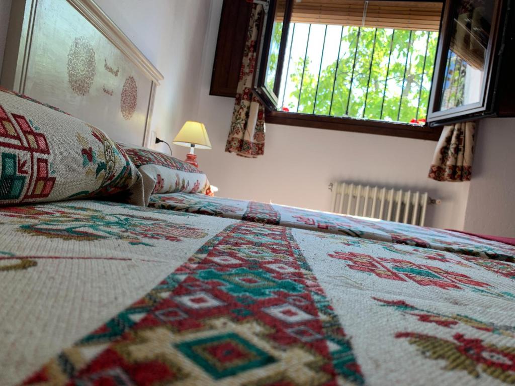 Postel nebo postele na pokoji v ubytování Hostal Atalaya en Capileira CB