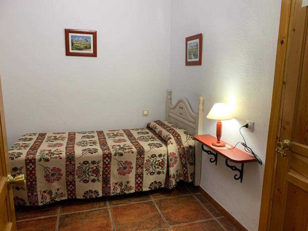 Postel nebo postele na pokoji v ubytování Hostal Atalaya en Capileira CB