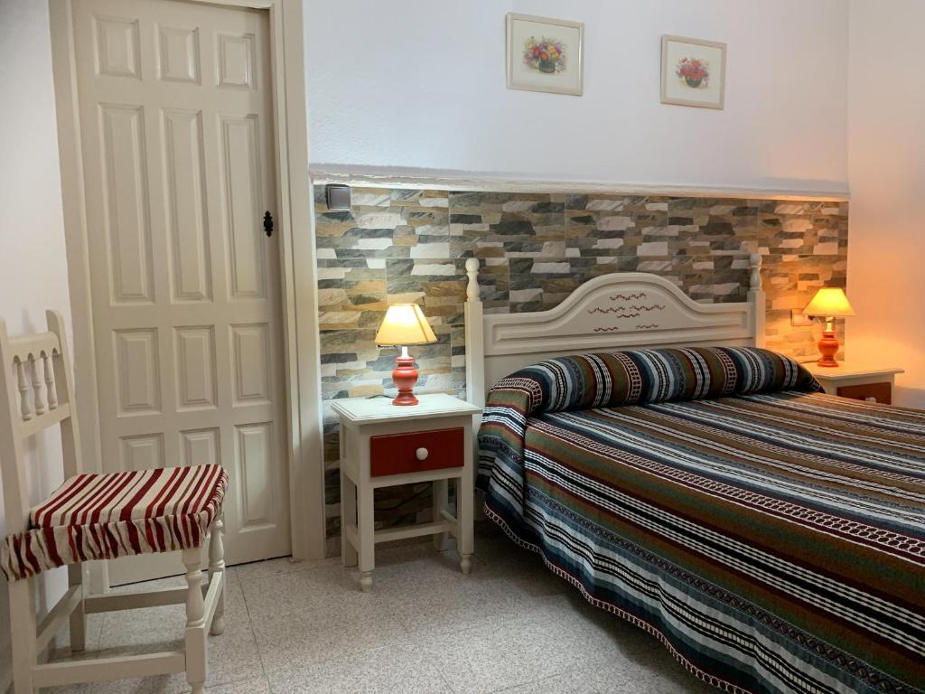 Postel nebo postele na pokoji v ubytování Hostal Atalaya en Capileira CB
