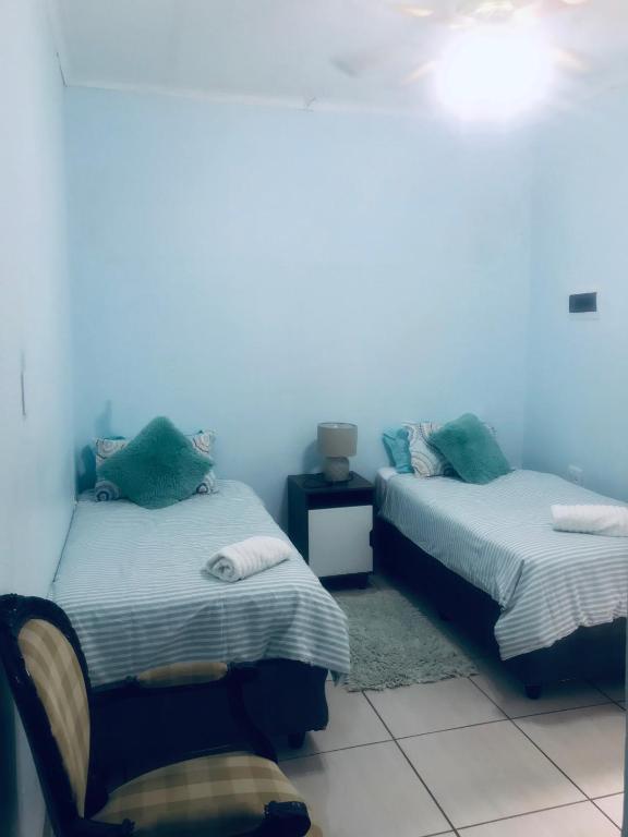 Rúm í herbergi á Ankuweni Guest house