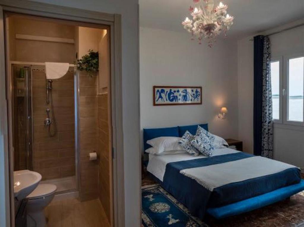 Postel nebo postele na pokoji v ubytování Casa Sulla Laguna