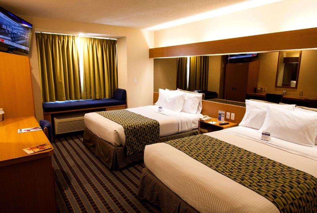 Postel nebo postele na pokoji v ubytování Microtel Inn & Suites by Wyndham Chihuahua
