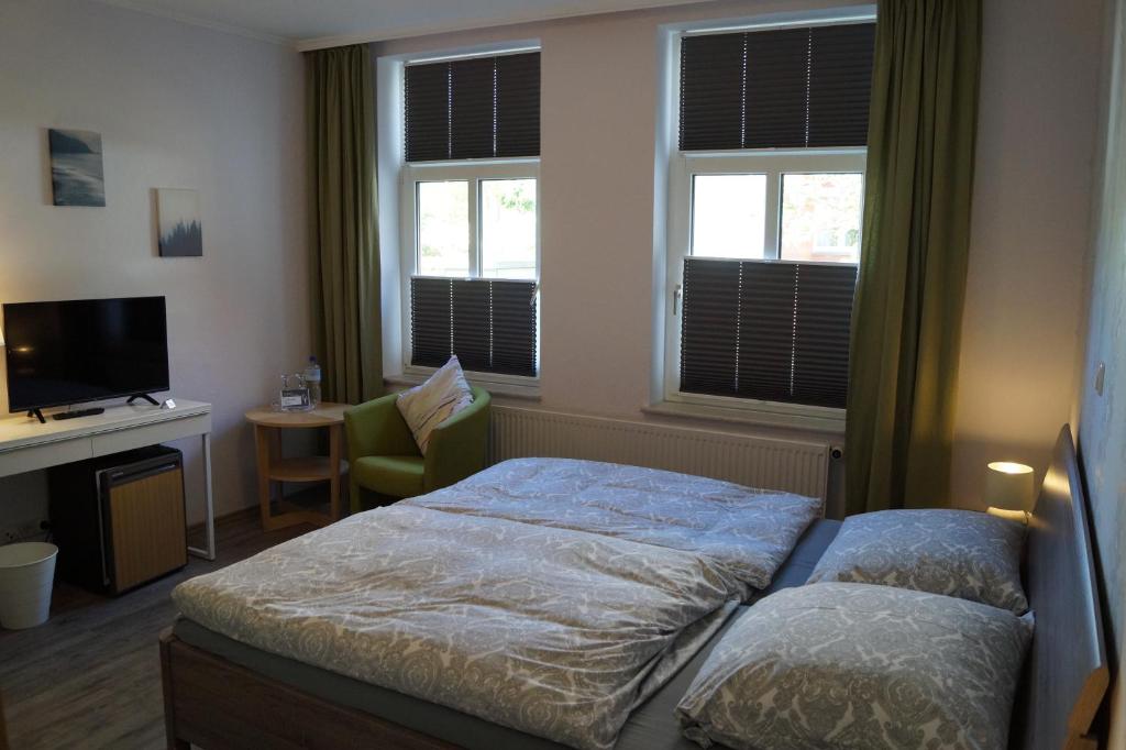 Postel nebo postele na pokoji v ubytování Hotel Villa Undine