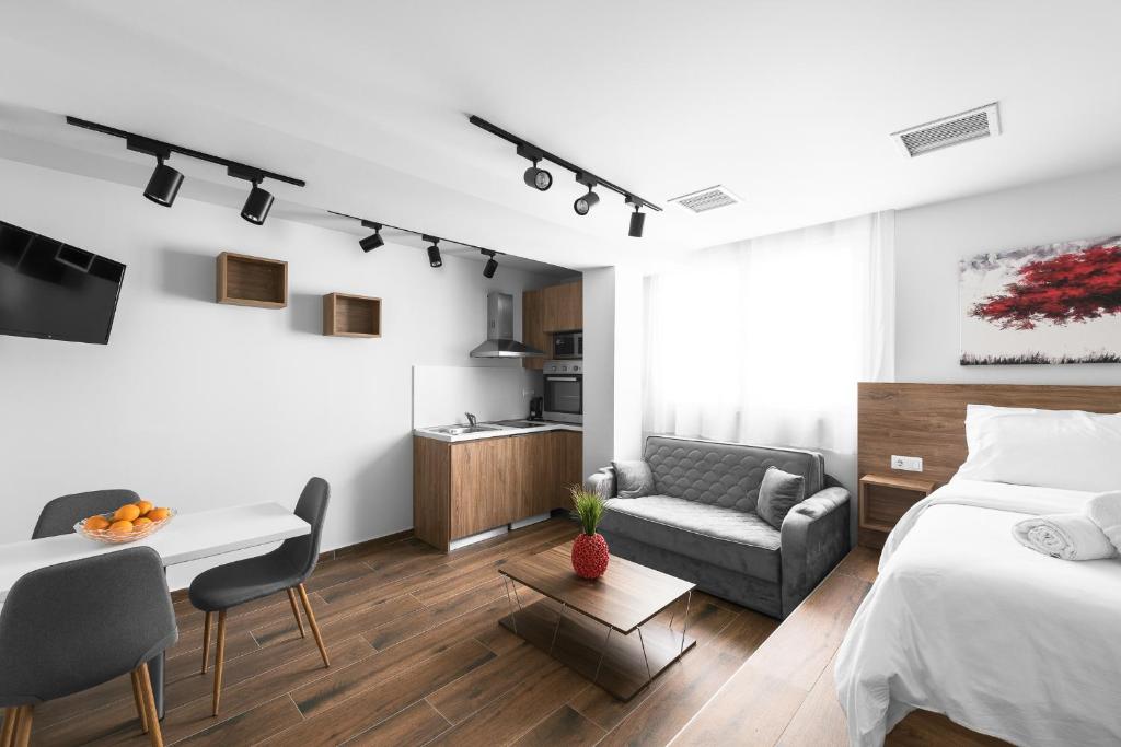 Televízia a/alebo spoločenská miestnosť v ubytovaní Ultima, Nilie Hospitality MGMT