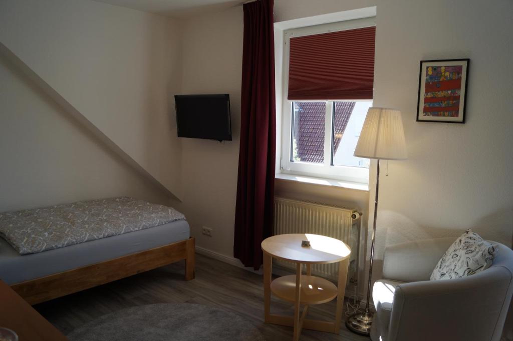 Postel nebo postele na pokoji v ubytování Hotel Villa Undine