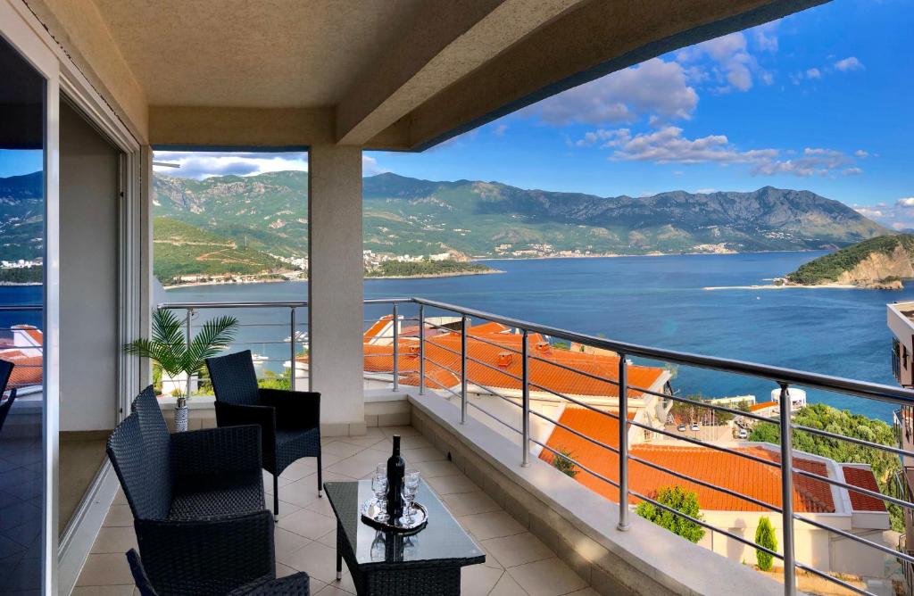 a balcony with a view of the ocean at Apartments Violeta in Budva