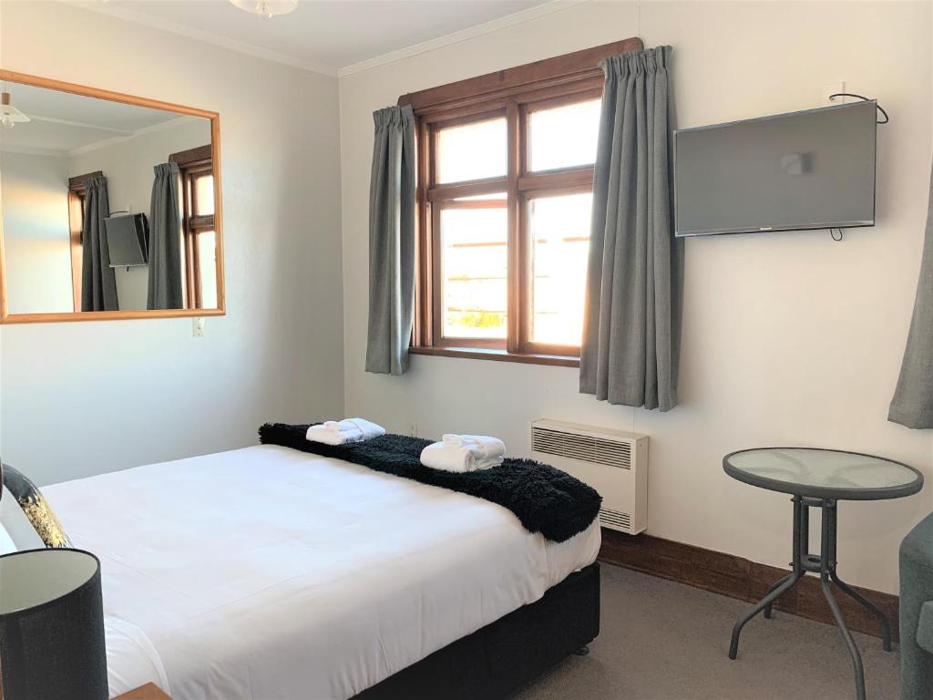 Postel nebo postele na pokoji v ubytování Ranfurly Hotel