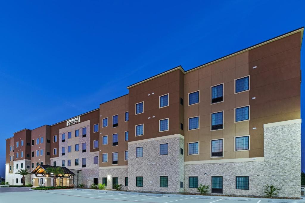 a rendering of the front of a hotel at Staybridge Suites - Houston IAH Airport East, an IHG Hotel in Humble