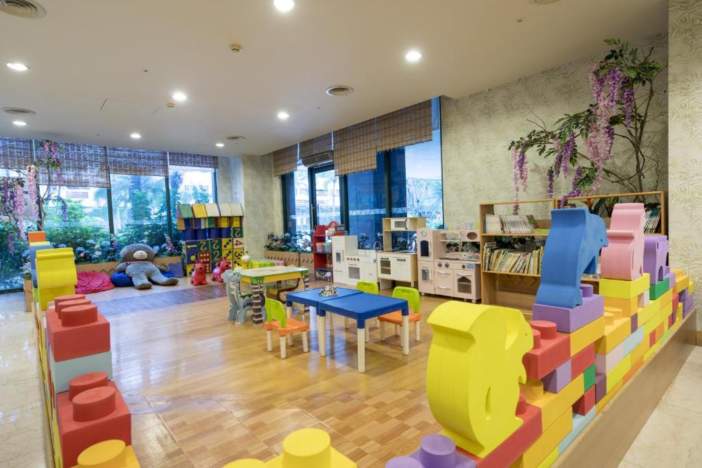 a childrens room with colorful chairs and tables at Formosan Naruwan Hotel in Taitung City