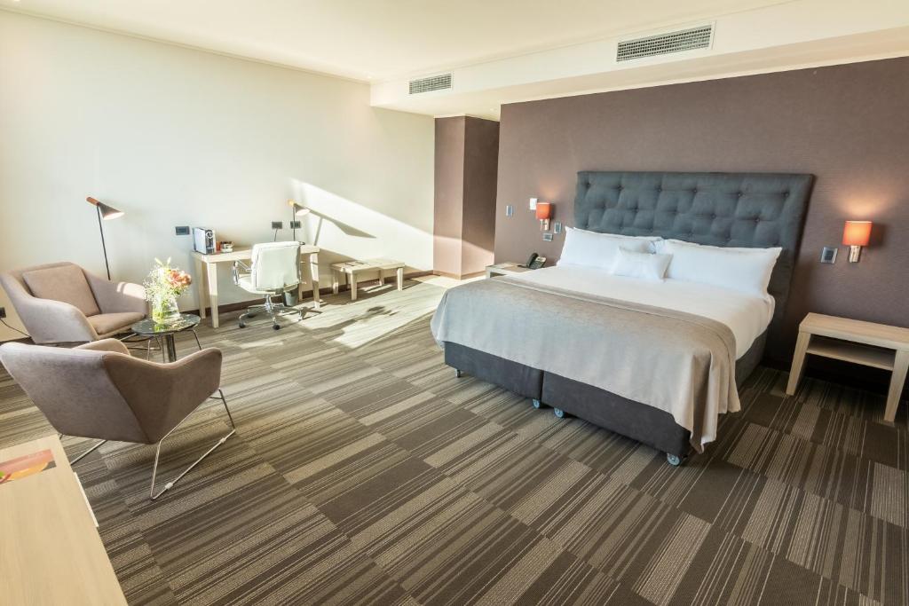 Postel nebo postele na pokoji v ubytování MDS Hotel Chillan