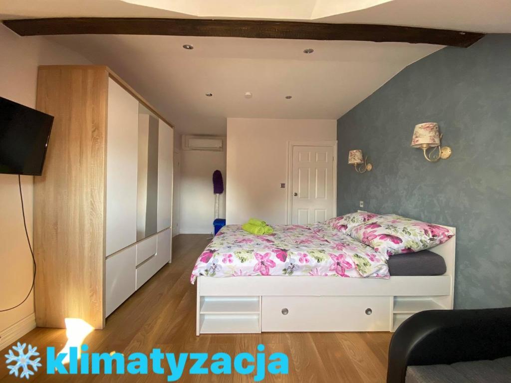 Łóżko lub łóżka w pokoju w obiekcie Słoneczne Wczasy