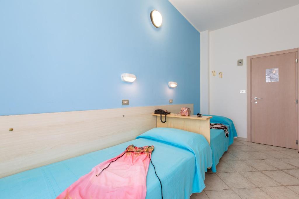 Postel nebo postele na pokoji v ubytování Hotel Sant'Angelo