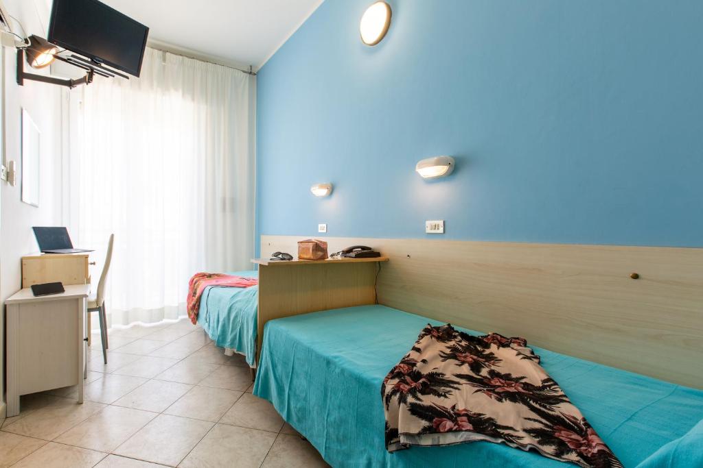 Postel nebo postele na pokoji v ubytování Hotel Sant'Angelo