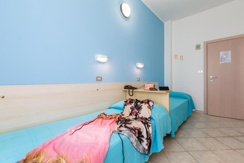 Postel nebo postele na pokoji v ubytování Hotel Sant'Angelo
