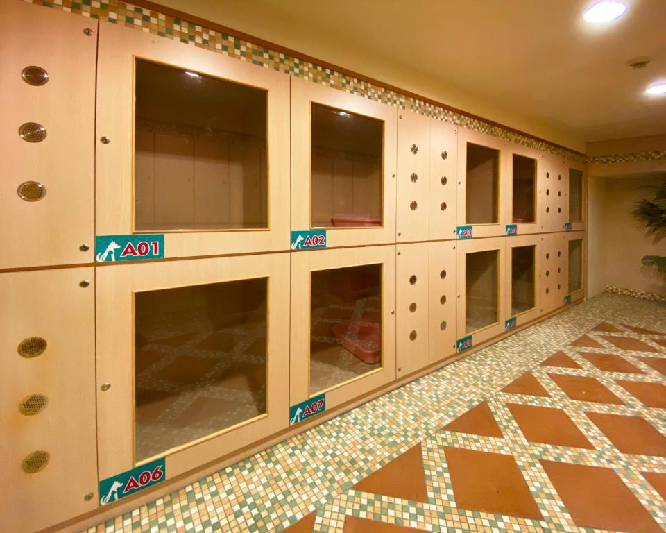 a room with a wall of cabinets with windows at Formosan Naruwan Hotel in Taitung City