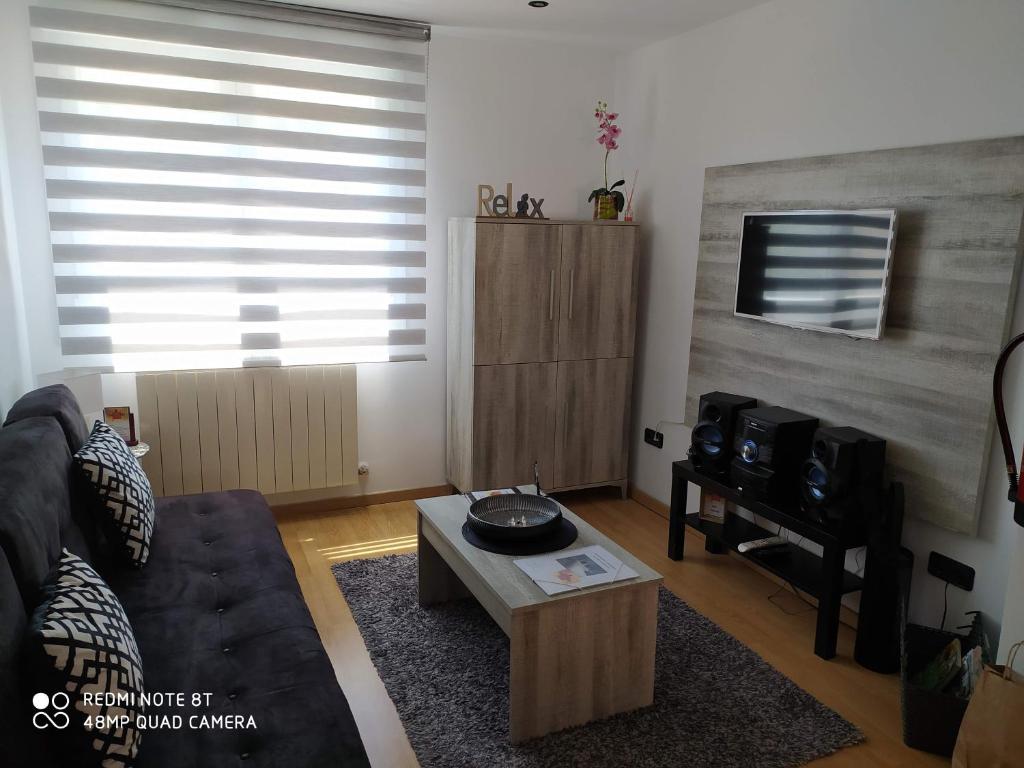 a living room with a couch and a coffee table at Vianatxiki in Viana