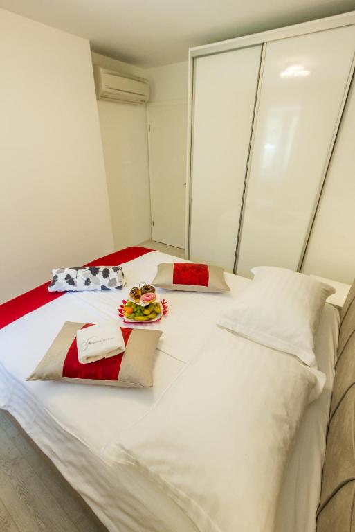 Postel nebo postele na pokoji v ubytování Aparthotel Gimi