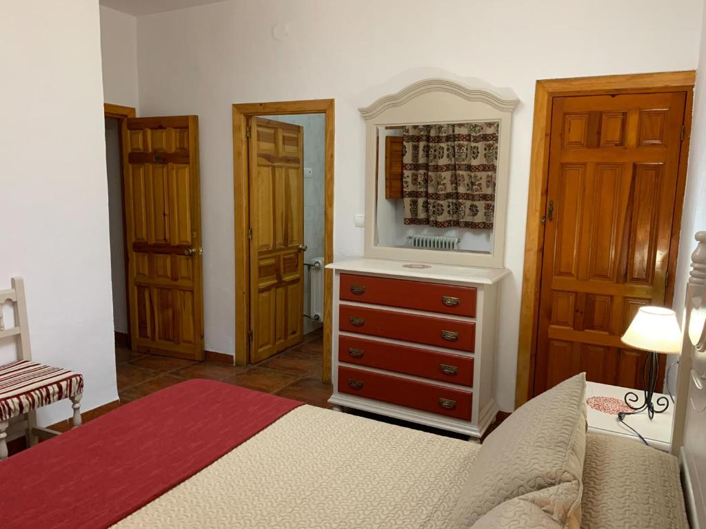 Postel nebo postele na pokoji v ubytování Hostal Atalaya en Capileira CB