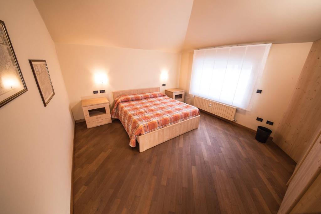 Postel nebo postele na pokoji v ubytování Appartamenti Pirovano Bormio