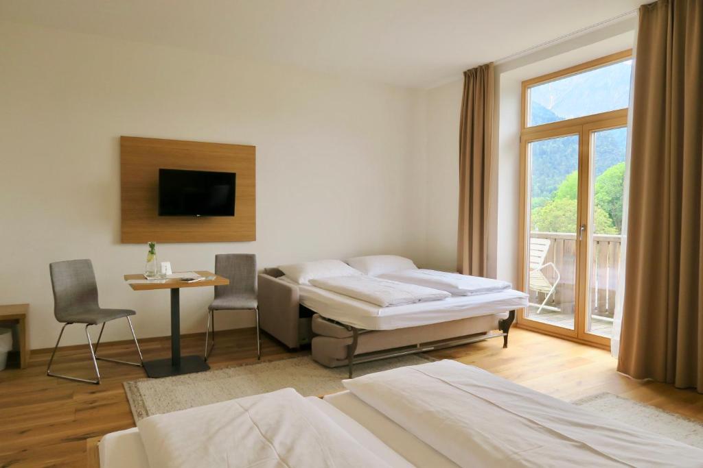Postel nebo postele na pokoji v ubytování Hotel Vötterl