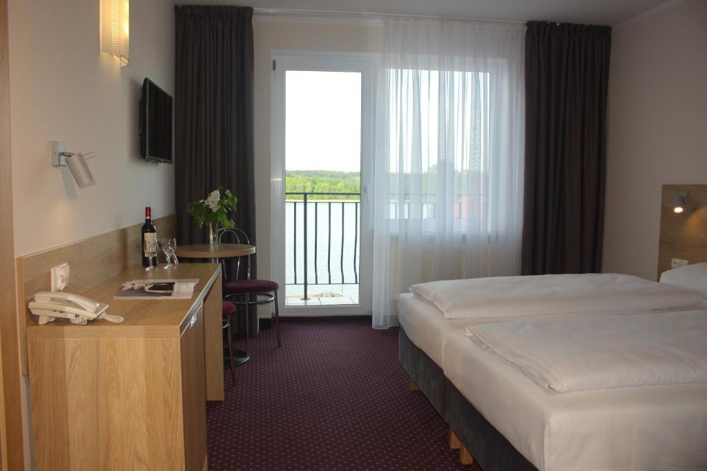 Posteľ alebo postele v izbe v ubytovaní Hotel Huszcza
