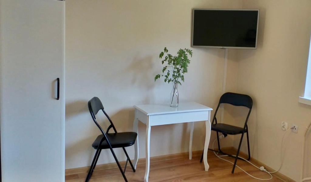 Televízia a/alebo spoločenská miestnosť v ubytovaní Apartament Gościnny Zakątek