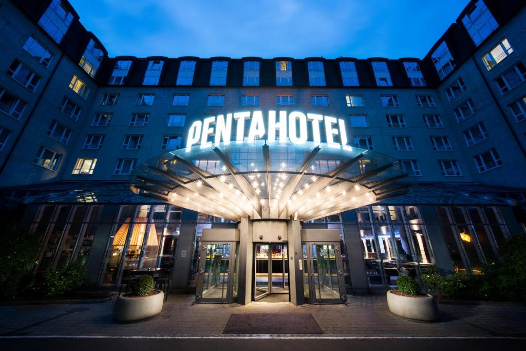 a hotel with a sign on the front of it at Pentahotel Leipzig in Leipzig