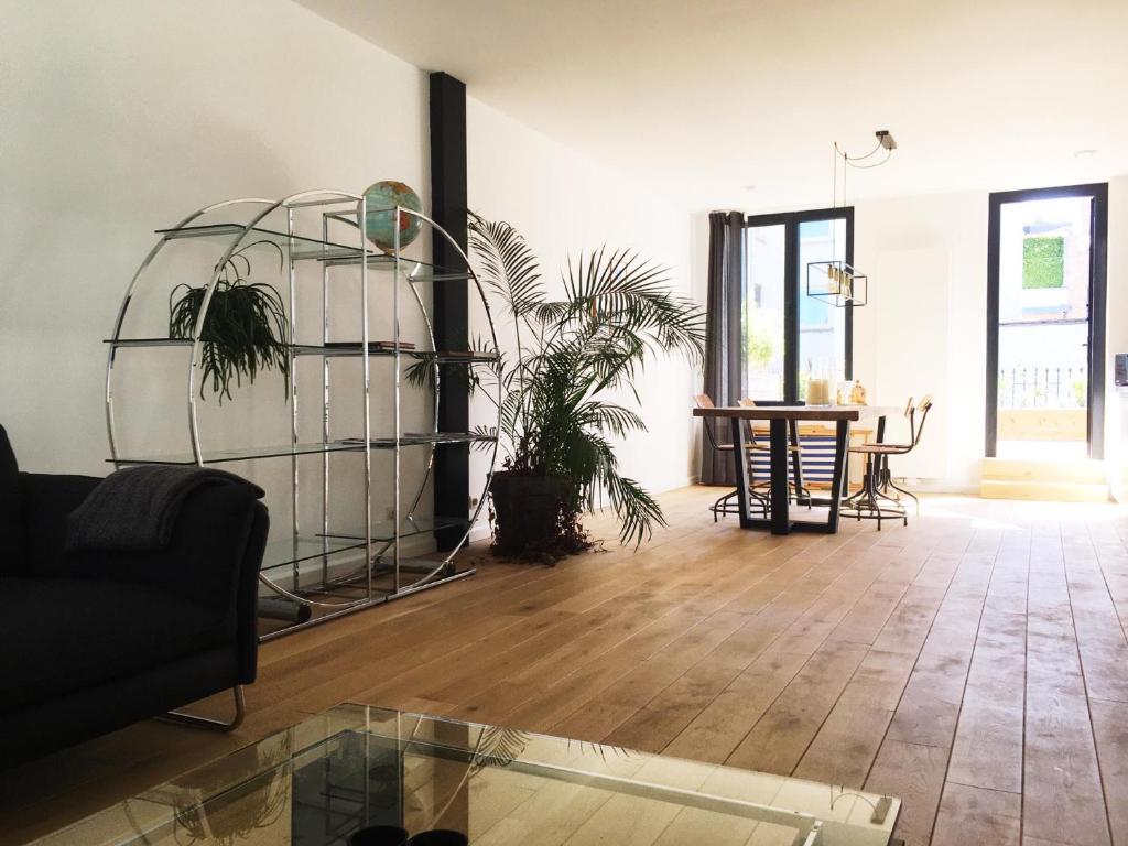 a living room with a couch and a table at Kloosterloft in Antwerp