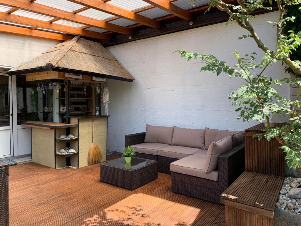 a patio with a couch and a gazebo at Dokazien in Waldems