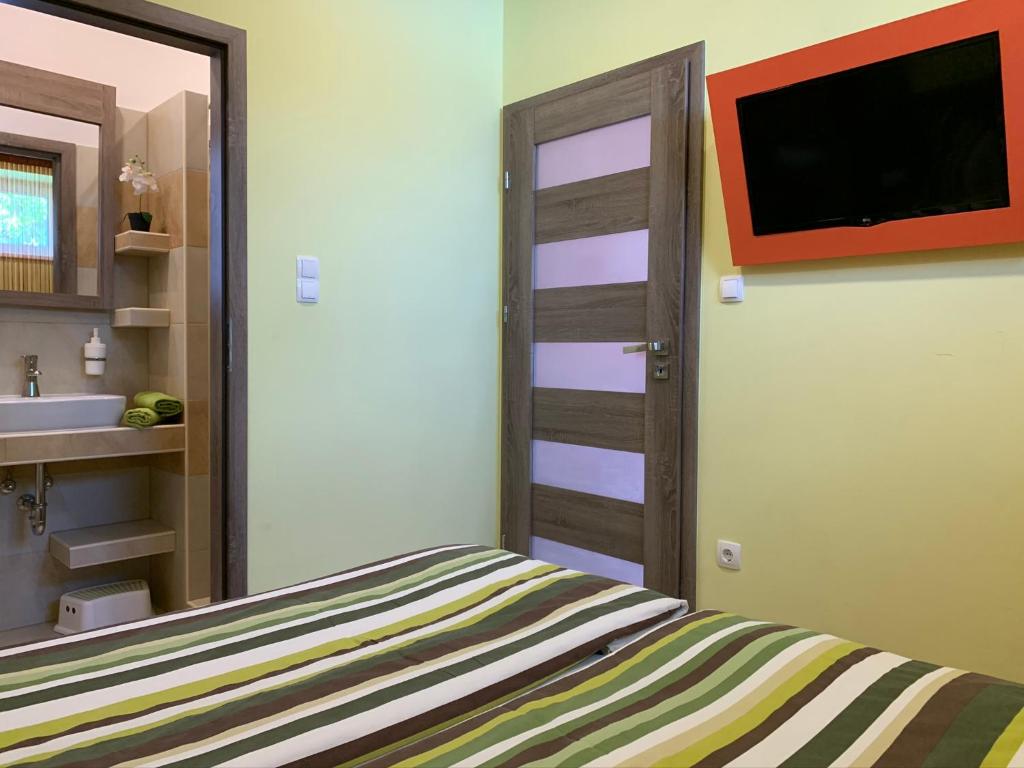 Telewizja i/lub zestaw kina domowego w obiekcie Armada Prémium Apartman