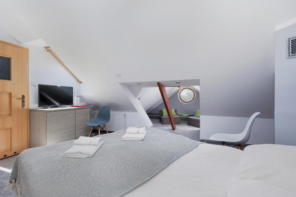 Ein Bett oder Betten in einem Zimmer der Unterkunft Willa Arielka