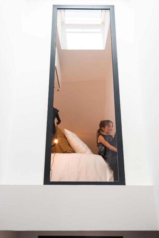 Postel nebo postele na pokoji v ubytov&aacute;n&iacute; Le Loft de La Tour Pinte