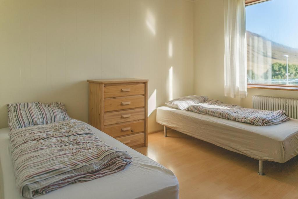 Postel nebo postele na pokoji v ubytování Hvammur 2 Guesthouse