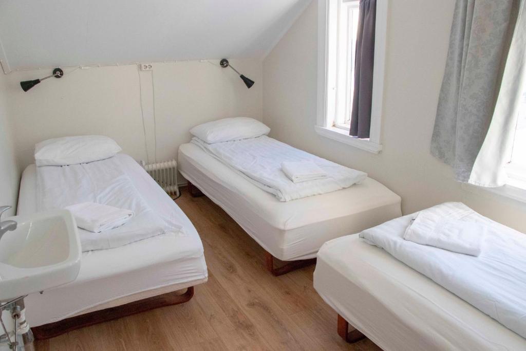 Postel nebo postele na pokoji v ubytování 1908 Hostel by Ourhotels