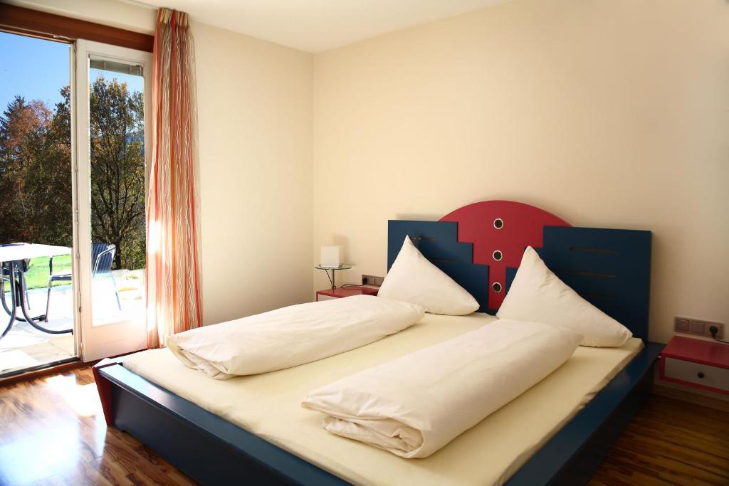 Postel nebo postele na pokoji v ubytování Hotel Auhof